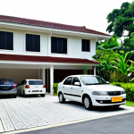 **

A cozy, modest terrace house in a suburban Malaysian neighborhood. Lush green garden, family-friendly environment. "Proton Saga" car parked in the driveway. Safe for work, fully clothed, appropriate content, professional photography, natural lighting, perfect anatomy, correct proportions.

**